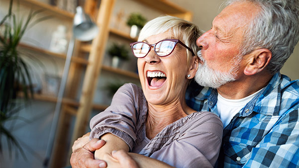 Couple with card smiling